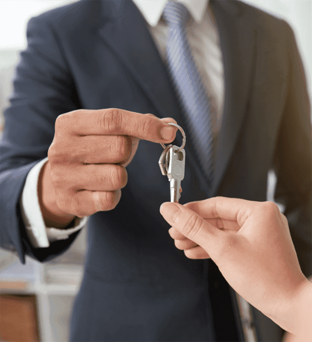 Real estate agent handing over keys